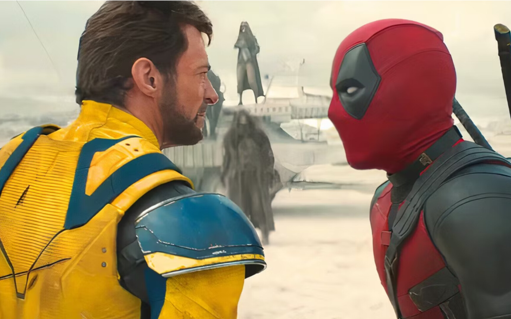 Deadpool & Wolverine look on each other